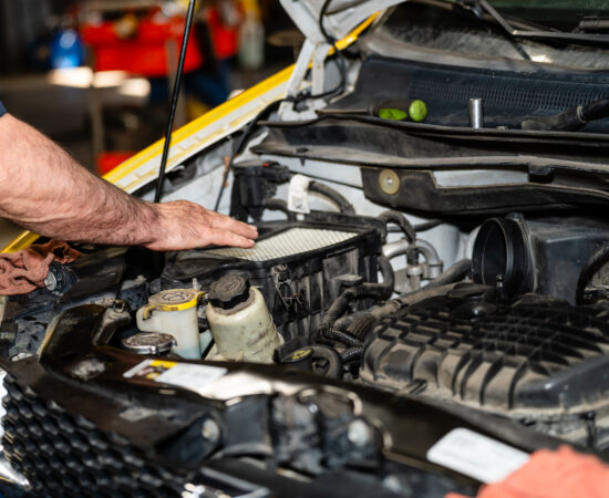 Technician performing auto maintenance