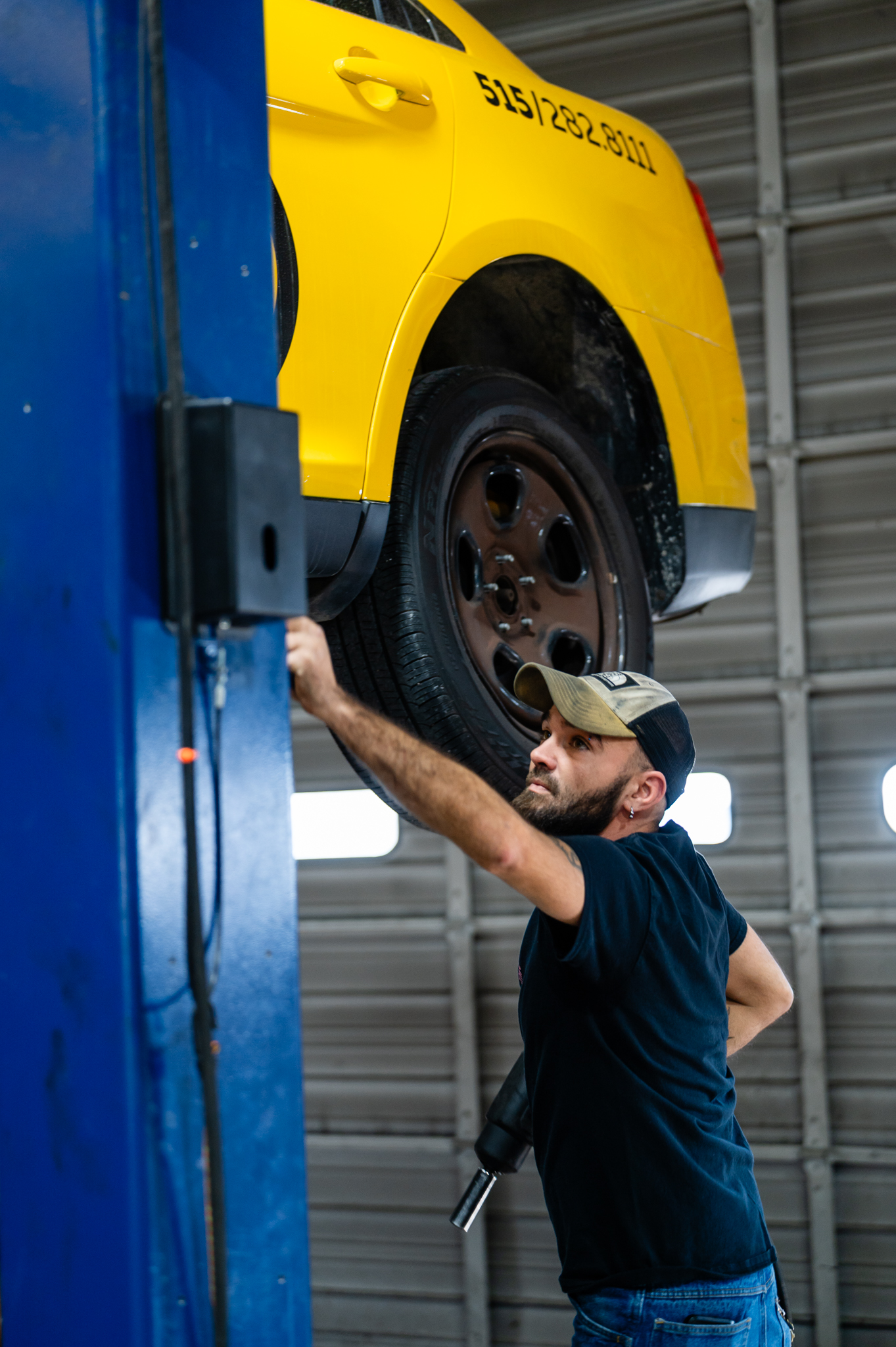 Brake technician completing comprehensive brake services in Des Moines (YCC Tire and Auto)