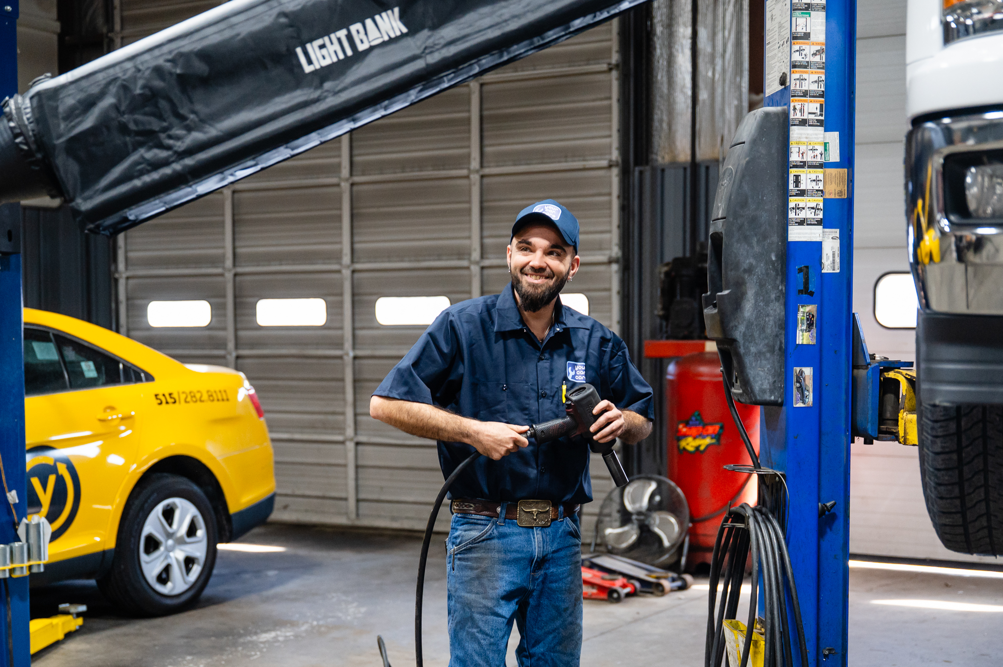 YCC Auto Care technician preparing for a maintenance check.