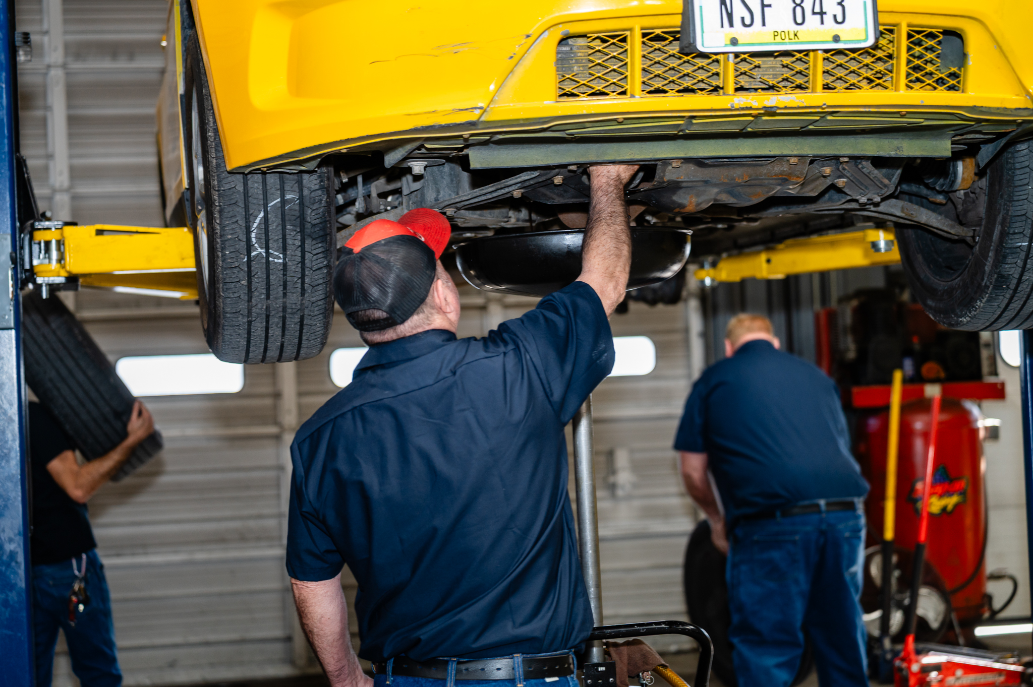YCC technician providing oil change in Des Moines