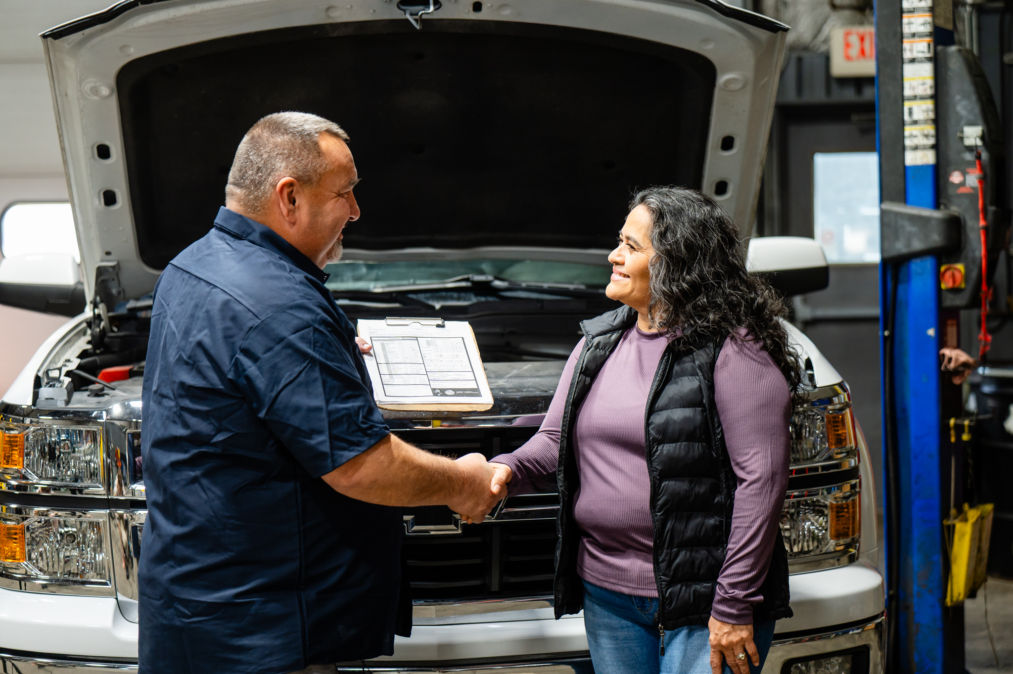 YCC technician shaking hands with a happy customer
