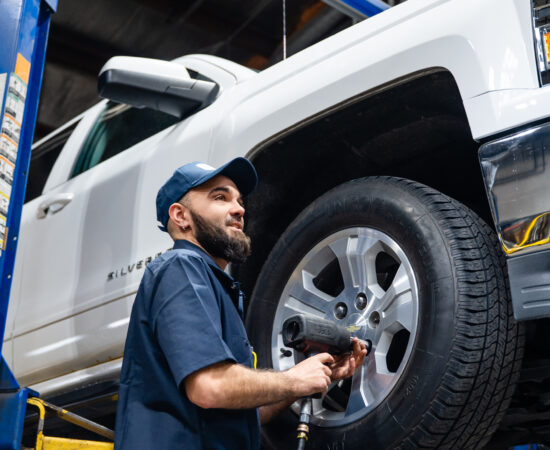 Des Moines technician at Your Car Care Tire and Auto performing tire services